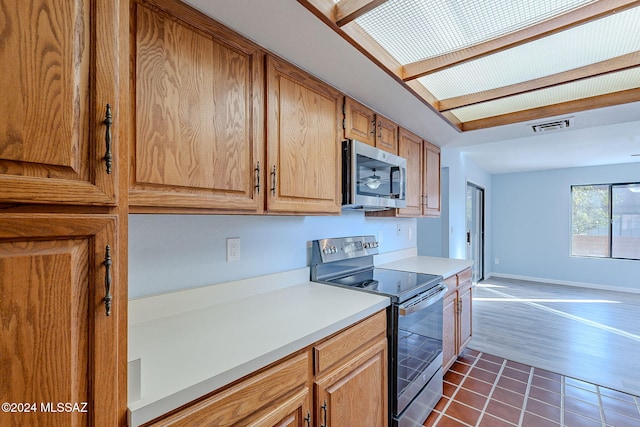 kitchen with stainless steel appliances and dark wood-type flooring