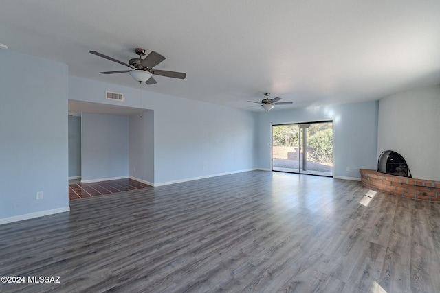 unfurnished living room with ceiling fan and dark hardwood / wood-style floors