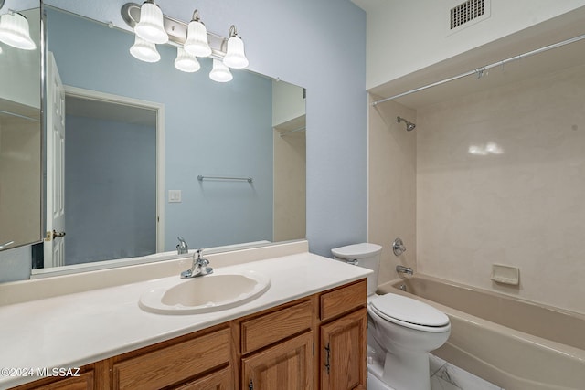 full bathroom featuring bathing tub / shower combination, vanity, and toilet