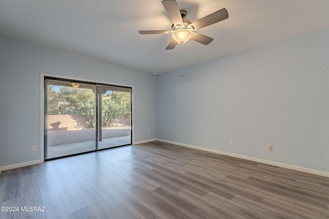 empty room with ceiling fan and hardwood / wood-style floors