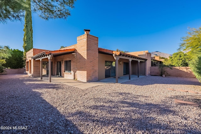 rear view of property with a patio area