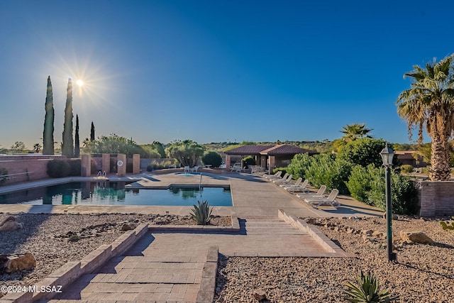 view of swimming pool featuring a patio