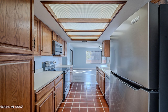 kitchen with tile patterned flooring and stainless steel appliances