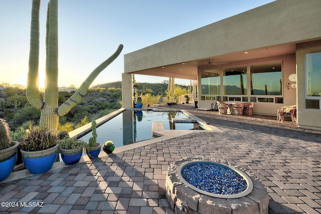 view of patio terrace at dusk