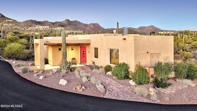 adobe home with a mountain view