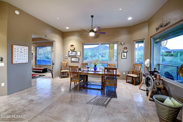 dining space featuring ceiling fan