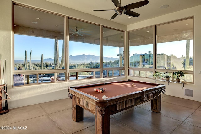 recreation room featuring a mountain view, tile patterned flooring, ceiling fan, and pool table