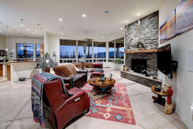 living room with a stone fireplace