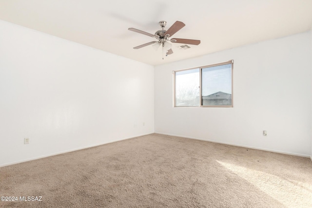 unfurnished room featuring carpet flooring and ceiling fan