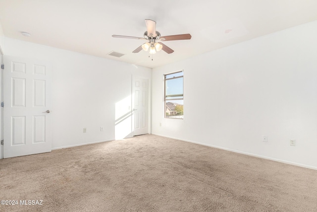 carpeted empty room with ceiling fan