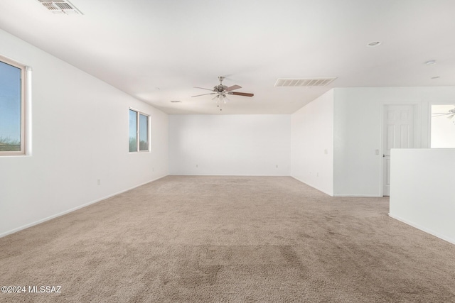 carpeted empty room with ceiling fan