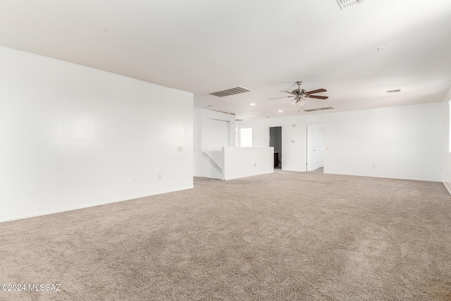 empty room with carpet and ceiling fan