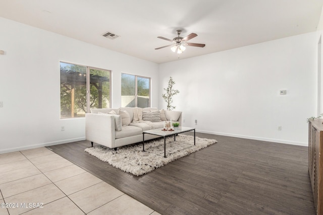 living room featuring ceiling fan and wood-type flooring