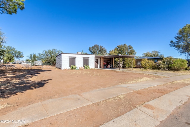 view of front of home with a carport