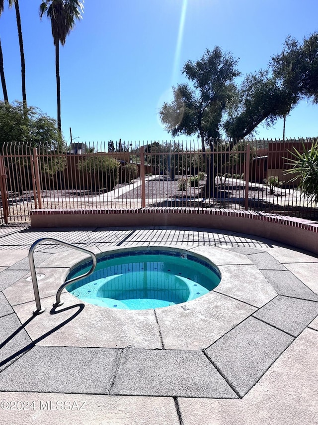 350 N Silverbell Rd Unit 96, Tucson, AZ 85745 - view of swimming pool featuring a community hot tub and a patio area
