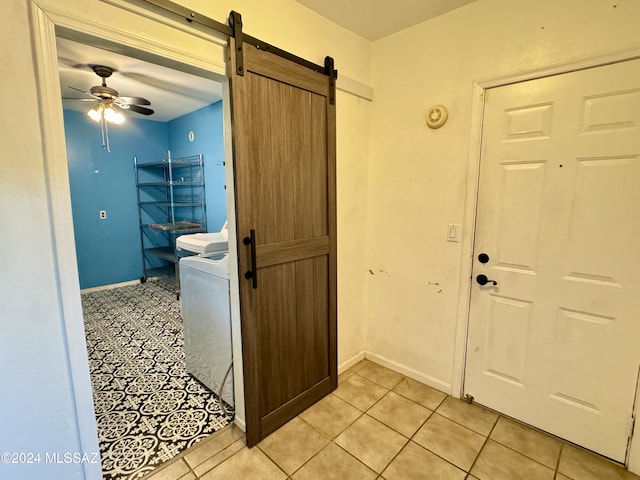 bathroom with tile patterned floors, ceiling fan, and washer / dryer