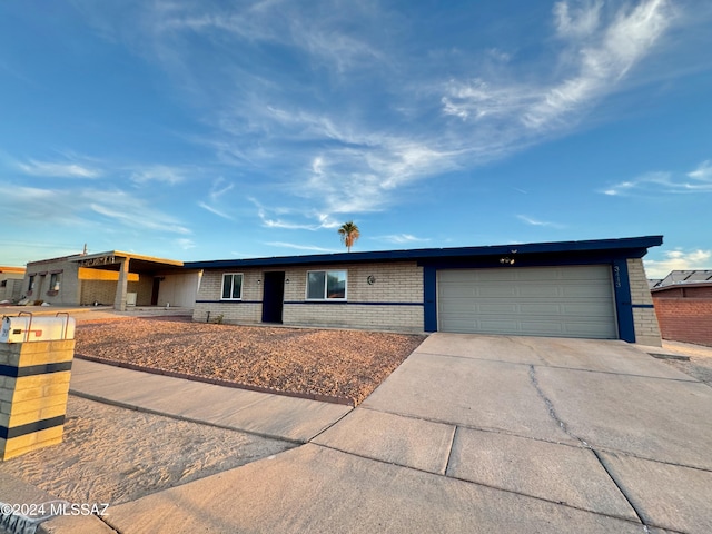 single story home featuring a garage