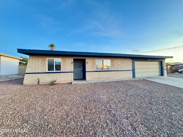 ranch-style home with a garage