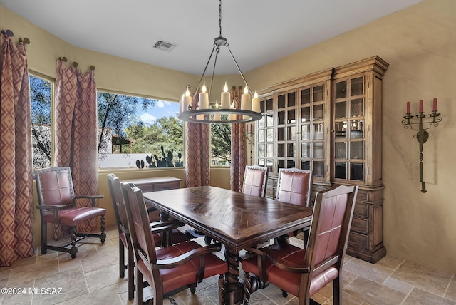 dining area featuring an inviting chandelier