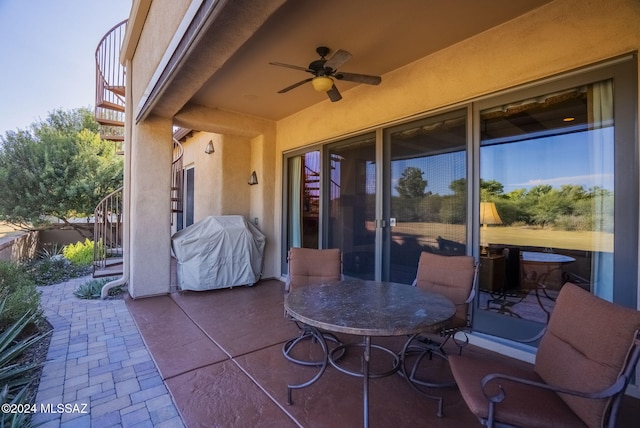 view of patio / terrace featuring ceiling fan and a grill