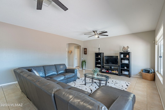 tiled living room featuring ceiling fan