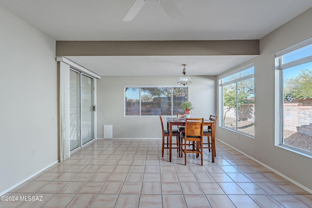 tiled dining room featuring a wealth of natural light and ceiling fan