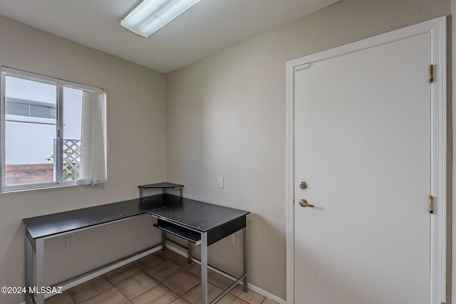 office with light tile patterned floors