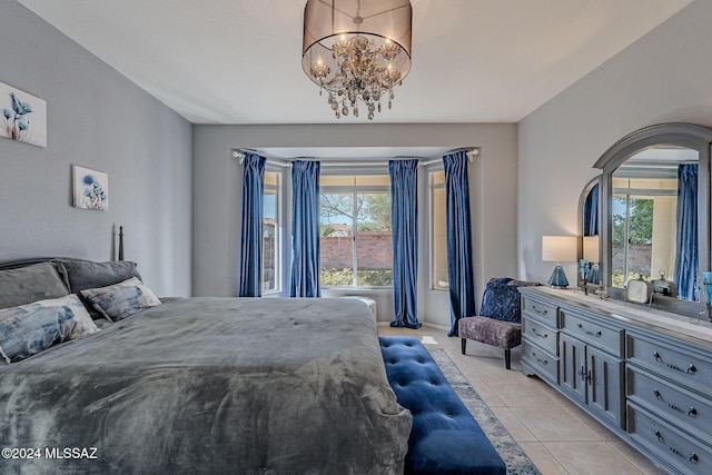 bedroom with an inviting chandelier, multiple windows, and light tile patterned flooring