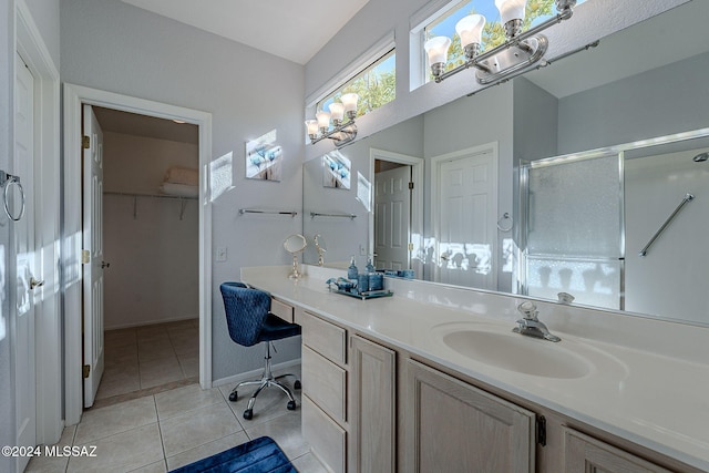 bathroom featuring vanity, tile patterned floors, and an enclosed shower