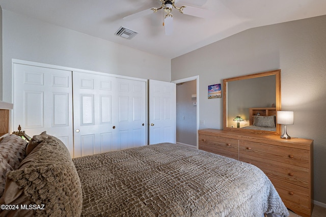 bedroom featuring ceiling fan, a closet, and vaulted ceiling