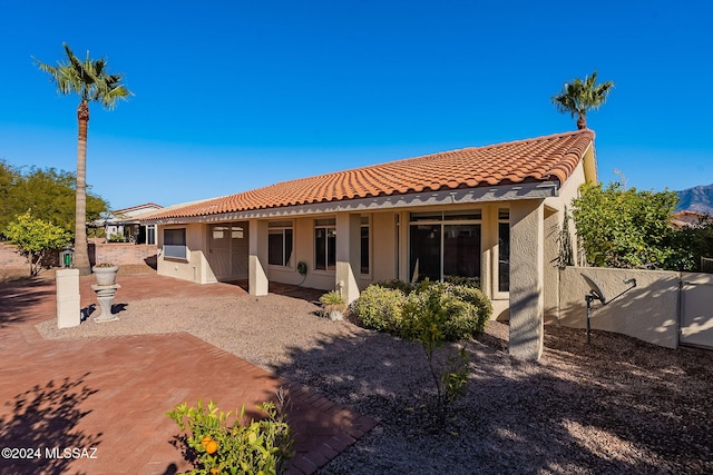 back of property featuring a patio area