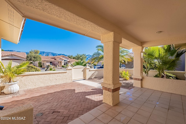 view of patio / terrace featuring a mountain view