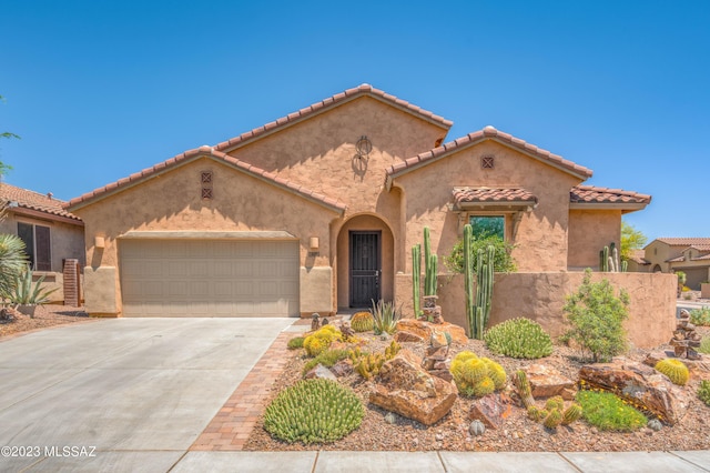 mediterranean / spanish house featuring a garage