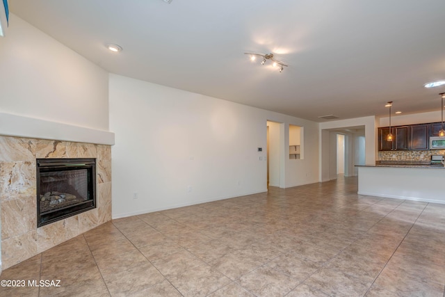 unfurnished living room with a fireplace