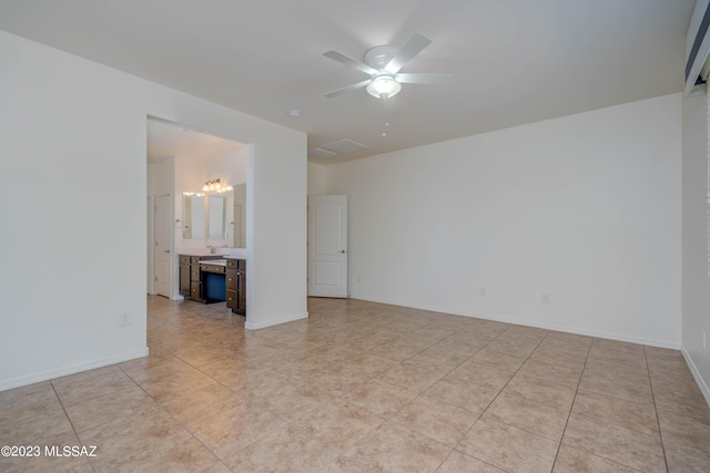 unfurnished room featuring ceiling fan and light tile patterned flooring