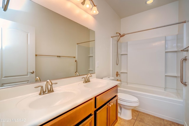 full bathroom featuring toilet, vanity, tile patterned floors, and bathtub / shower combination