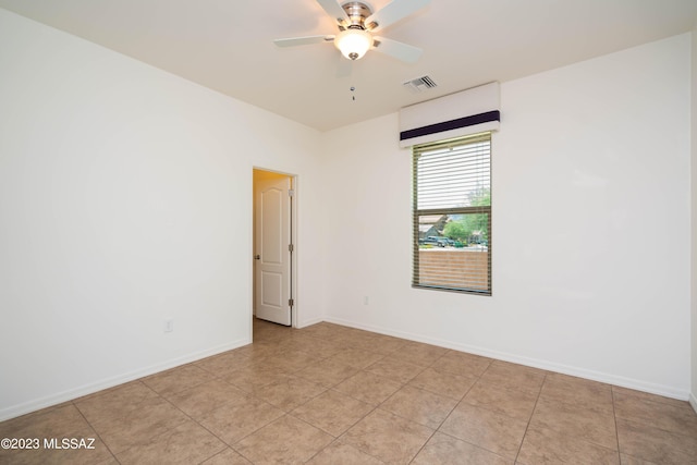 empty room featuring ceiling fan and light tile patterned flooring