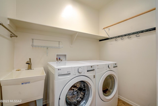 laundry room with sink and washing machine and clothes dryer