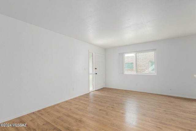 empty room with light wood-type flooring