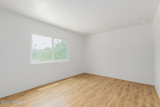 unfurnished room featuring light hardwood / wood-style flooring