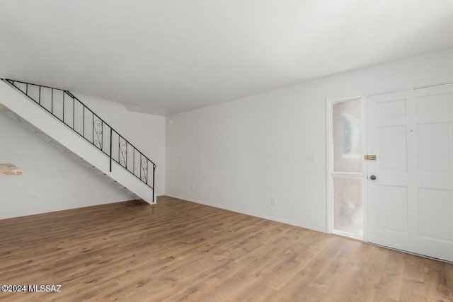 unfurnished living room with light hardwood / wood-style flooring