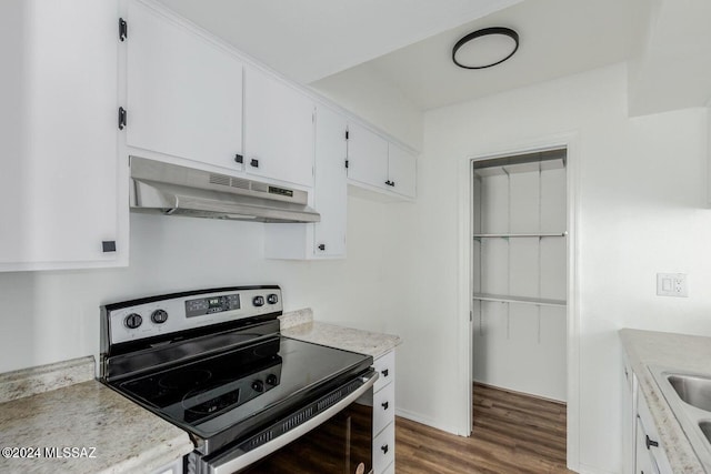 kitchen featuring white cabinetry, electric range, and dark wood-type flooring