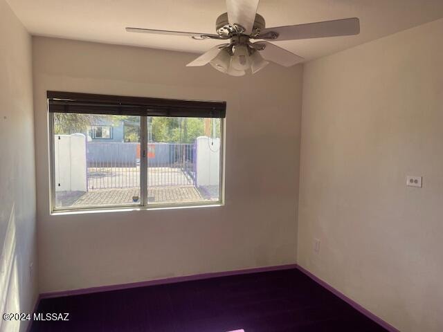 unfurnished room featuring ceiling fan and hardwood / wood-style floors