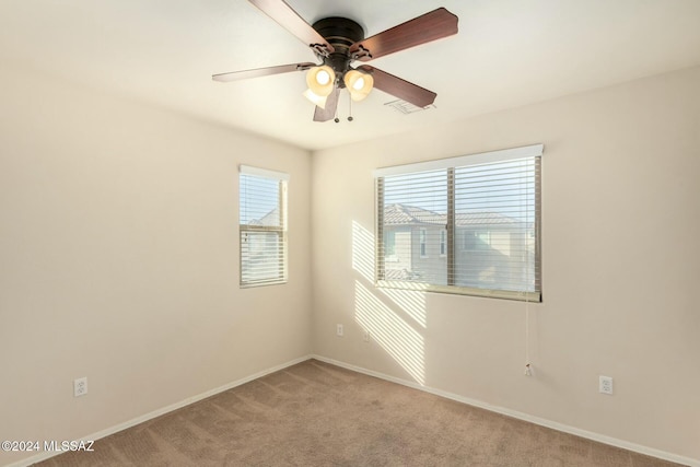 empty room with carpet flooring and ceiling fan