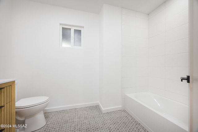 bathroom featuring tile patterned floors, vanity, and toilet