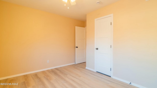 unfurnished room with light hardwood / wood-style floors and ceiling fan