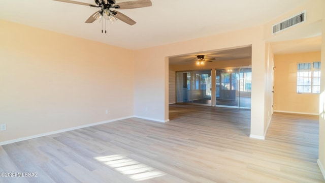 empty room featuring ceiling fan and light hardwood / wood-style floors