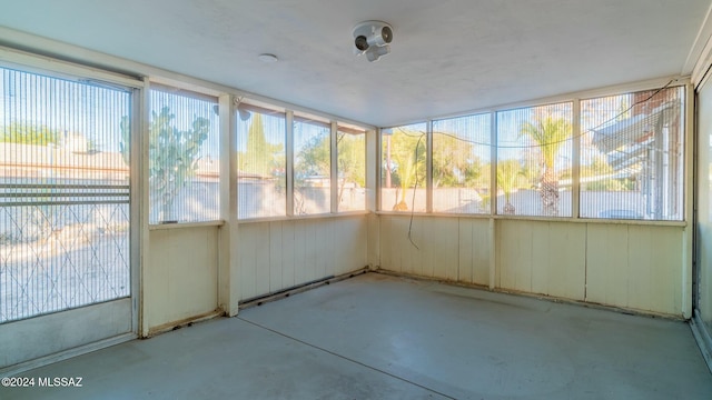 unfurnished sunroom with plenty of natural light