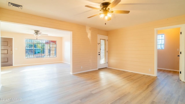 empty room featuring light wood-type flooring and ceiling fan