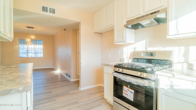 kitchen featuring white cabinets, ventilation hood, stainless steel range with gas cooktop, and light hardwood / wood-style flooring